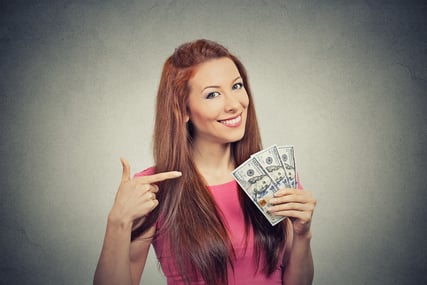 Closeup portrait super happy excited successful young business woman holding money dollar bills in hand isolated grey wall background. Positive emotion facial expression feeling. Financial reward-2