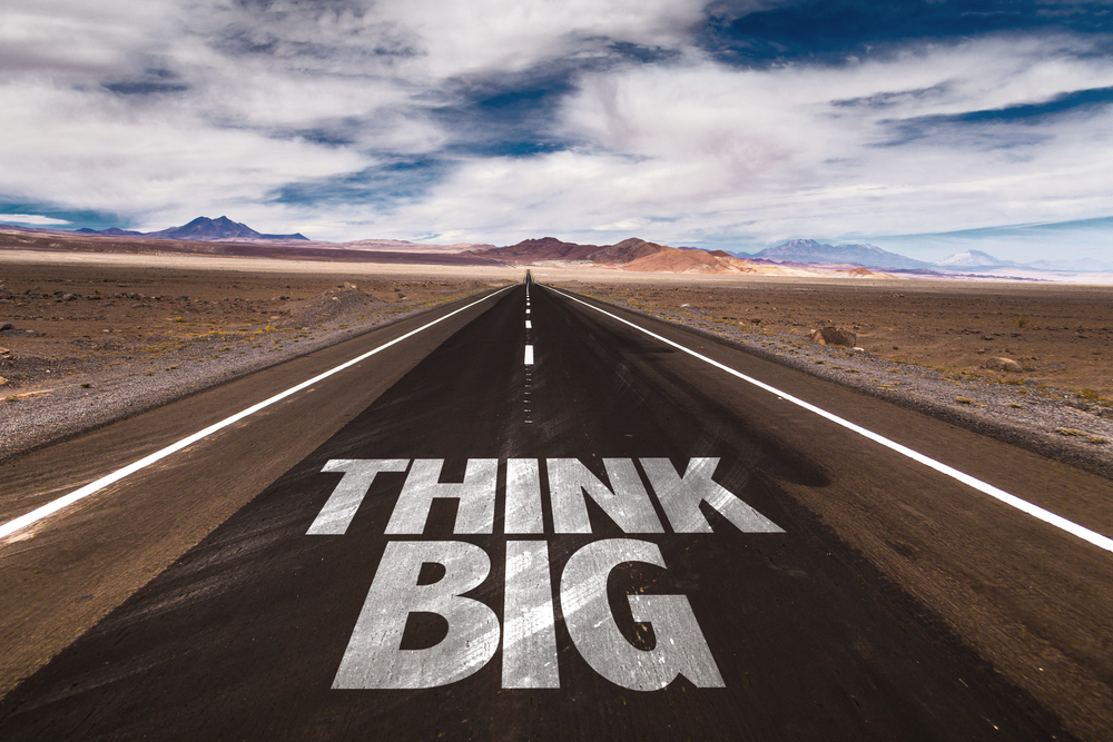 Think Big written on desert road